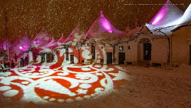 The lights, the snow, the red and the trulli of Alberobello